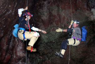 Friendly cavers ascending ropes in Cueva Iztaxiatla Lava Tube, Morelos. Most caves in Mexico are found in limestone and often display magnificent stalactites, stalagmites and other formations like draperies, shields and gravity-defying helictites. © John Pint, 2010