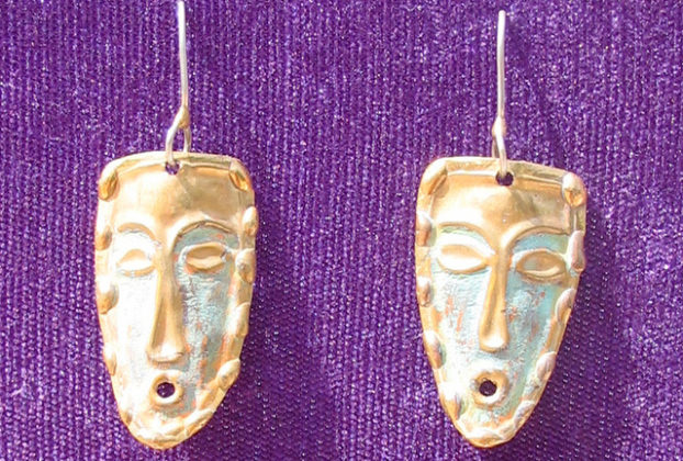 Bronze earrings by Mexican artisan Armando Lozano take the shape of masks. © Alvin Starkman 2008
