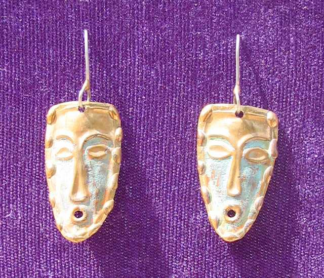 Bronze earrings by Mexican artisan Armando Lozano take the shape of masks. © Alvin Starkman 2008