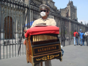 Despite the outbreak of swine flu, life goes on for this organ grinder in Mexico City. © Anthony Wright, 2009