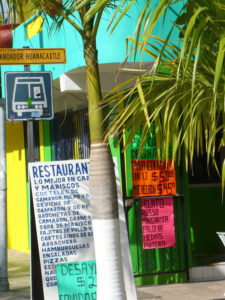 A casual restaurant in Sayulita posts its menu on a board by the door. Set on Mexico's Pacific coast, Sayulita offers great surfing. © Christina Stobbs, 2009