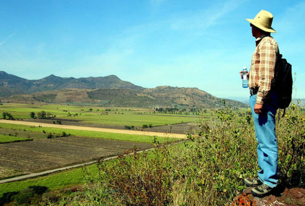 An archeologist looks out over what was once Lake Magdalena from the top of former Itztlitlan Island, thought to have been the largest obsidian workshop in the world. The 53-kilometer stretch of highway from Tala to San Marcos in the state of Jalisco boasts many fascinating sites. © John Pint, 2009