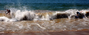 A surf rider tries to tame a cascade of water breaking on the beach of Melaque on Mexico's Costa Alegre, or Happy Coast. © Gerry Soroka, 2009