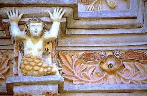 Strange, syncretic symbolism mark the facade of Tilaco, like this mermaid.