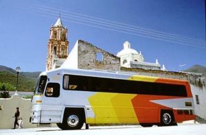 A typical first class bus waits beside one of the glorious Missions of the Sierra Gorda, in the state of Querétaro. Buses are the primary form of transportation throughout Mexico, and, contrary to rumor, rarely do you share seat space with chickens. There are first class buses complete with TV, bathroom, telephone, snacks and cold drinks. The second class buses are more utilitarian, but still offer comfortable travel.