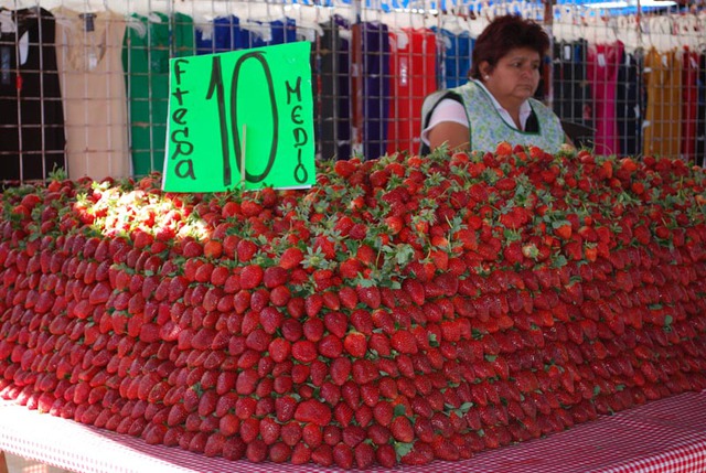 Fresh strawberries for sale at the Tuesday Market in San Miguel de Allende, Mexico © John Scherber, 2013