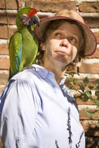 Bonnie Jauregui with a military macaw © Petr Myska, 2013