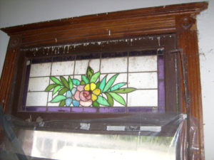 This elegant stained glass panel graced the bathroom window of Mi Pullman, a Mexican art nouveau home built in 1906. Here it appears in the the original, badly damaged wood frame. During restoration, the old window was removed and replaced by a clean cut aluminum window while the stained glass was saved and used in the top panel. The author restored this beautiful landmark in downtown Chapala, designed by architect Guillermo de Alba. © Ros Chenery, 2010