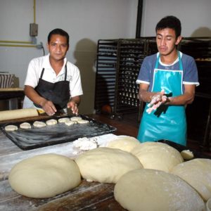 Preparing bread for the 2,000 boys at Villa de los Niños near Guadalajara, Mexico is a monumental task. © John Pint, 2012