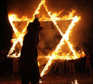 Setting fire to a six-pointed star (locals refer to as the Star of David) is part of a "black mass" ritual supposedly aimed at fending off evil spirits. Catemaco, Veracruz, is Mexico's cradle of sorcery and witchcraft. © Courtesy of Ayuntamiento de Catemaco, 2010