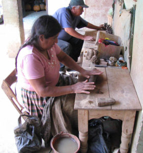 José María Alejos Madrigal and his wife Cecilia mold clay pots in their workshop in San José de Gracia.