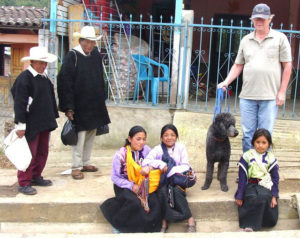 Bill Wilkinson with the dogs, Milo and Pancho, make friends in San Juan Chamula, a small Maya town and ceremonial center in Chiapas. © Jane Wilkinson, 2009