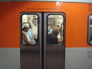 Passengers stoically board a Mexico City train on April 27, but numbers are way down in what is normally "crush hour." © Anthony Wright, 2009