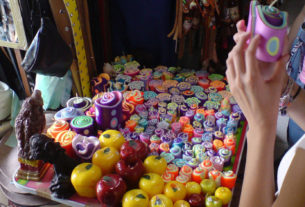 Craftspeople show off their work in the market in Tequisquiapan, Queretaro. These colorful candles are crafted by hand. © Daniel Wheeler, 2009
