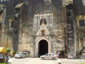 The entrance to Cuernavaca's 16th century Catedral de la Asunción dwarfs cars outside. © Anthony Wright, 2009