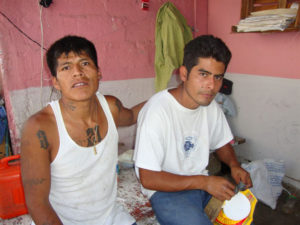 Inmates at the Oaxaca State prison wear street clothes, as there were no prison uniforms at the time of the author's visit. The beds are poured-in-place concrete. © John McClelland, 2010