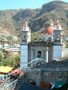 Evidence that you are in a valley are these mountains that surround Chalma on all sides but west. Left looking across the church courtyard to the north the hills are covered with white crosses on top. Right another good view of the church.