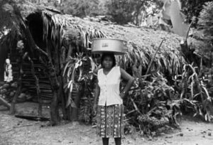 Making the Rounds (1997) Manuela, the lady of the house where I live, was out making her rounds through town selling bread when I snapped this photo. While there are indigenous people throughout Mexico who carry burdens on their heads, there is little doubt that in the Costa Chica, the custom is of African origin. The most common things women carry in this way are firewood, water, and washboards and laundry.