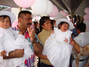 Reverend Spencer Thompson officiates at the christening of a prisoner's daughters.This is a part of his pastoral care at the Oaxaca State Prison. © John McClelland, 2010