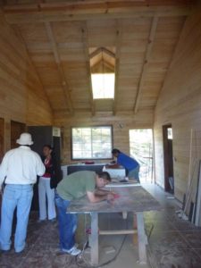 Tha eauthor's cabin in Tierra Alta has an open floor plan. This view shows the living area and, to the back, the kichen © David Kimball, 2014