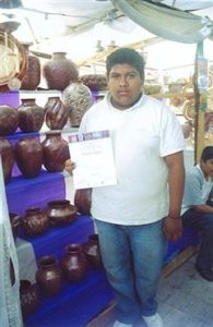 Luis Felipe Punzo Chávez, 15, with his first place diploma won in the 46th Annual Domingo de Ramos crafts contest in April 2006.
