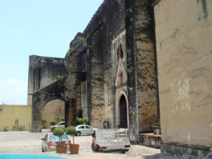 Indigenous labor and craftsmanship built the Cuernavaca Cathedral in the 16th Century. A flying buttress to the rear of the photo holds up the massive, austere walls. © Anthony Wright, 2009