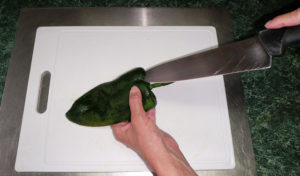 It's easiest to remove the seeds if you cut the top of the chile. © Daniel Wheeler, 2010