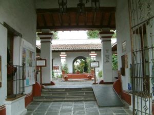 The main entrance and atrium just within. The Parroquia de Guadalupe, also built by the Bordas, looms above. Cuernavaca, Morelos © Rick Meyer 2006