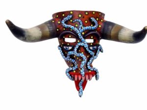 Blue serpents slither across an elongated face with the horns of a bull. Named "Metamorphosis," this enigmatic Tastoan mask is the work of Prudencio Guzman of Tonala, Jalisco. The fearsome Tastoanes battle Saint James in a ritual dance each year on July 25th. © Kinich Ramirez, 2006