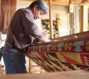 Federico Chavez Sosa painstakingly creates a custom rug. He works with virgin wool on a traditional handloom. © Norma Hawthorne 2008