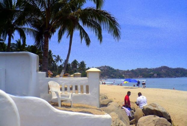 Sayulita beach is stunningly beautiful. The two-mile long beach on Mexico's Pacific coast boasts soft fine sand, warm blue waters and perfect surfing waves. © Christina Stobbs, 2009