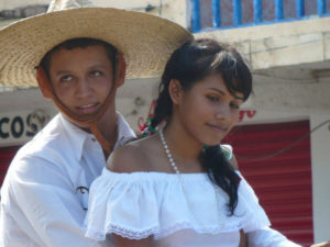 Dressed as a charro, a young man courts his sweeteheart. The couple was phoographed at La Peñita de Jaltemba on Mexico's Nayarit Riviera. © Christina Stobbs, 2009