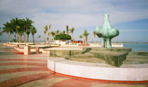 The malecón, with one of the original sculptures along the sea walk
