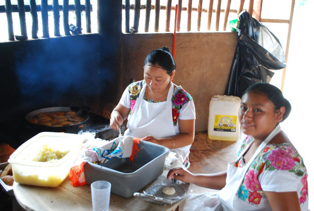 Women prepare empanadas for a Day of the Dead celebration in Pac Chen, a Mayan jungle village in Quintana Roo. © Jane Ammeson, 2009