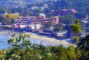 The beach of Rincon de Guayabitos beach offers shallow safe swimming waters, gentle waves that are perfect to play in, and three miles of fine, velvety sand. Comfortable hotels and condos line this part of Mexican Pacific. © Christina Stobbs, 2009