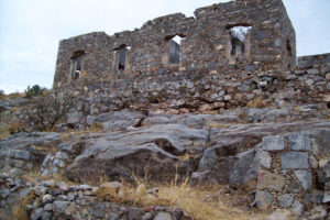 A stone building on a stony hill marks the spot of Ojuela, an abandoned Mexican mining town in Durango. © Jeffrey B. Bacon, 2011