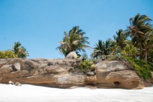 Smoothed by wind and waves, rugges ricks rest on the sugary sand of Playa Destiladeras, a beautiful beaco on Mexico's Nayarit Riviera. © Christina Stobbs, 2012