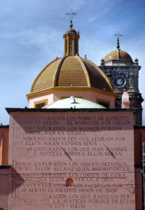 Magnificent domes crown the church on the plaza in Amatitan, Jalisco, and an engraving of the Eight Beatitudes stands outside. They are credited to famed Mexican architect Luis Barragan. © John Pint, 2010