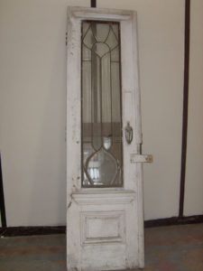 This is the original front door of Mi Pullman, a famous landmark in Chapala. The Mexican art nouveau home was built in 1906 by architect Guillermo de Alba. This must have been a beautiful door in its time. It had obviously been replaced several years earlier by a metal door and had just been discarded and left to the termites.Sadly, it was badly damaged and unusable in its present state. The author managed to save the crystal glass panels and these will be restored and used in doors for a wardrobe. © Ros Chenery, 2010