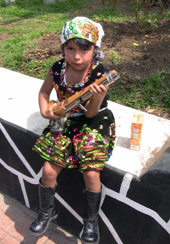 Don't mess with me! A 6-year-old girl with musket is dressed to celebrate el Cinco de Mayo in Mexico City. © Donald W. Miles, 2009