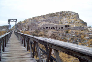 A view of Mexico's Ojuela ghost town from the mine. The narrow suspension bridge, the 'Puente de Ojuela,' is some 900 yards long. © Jeffrey B. Bacon, 2011