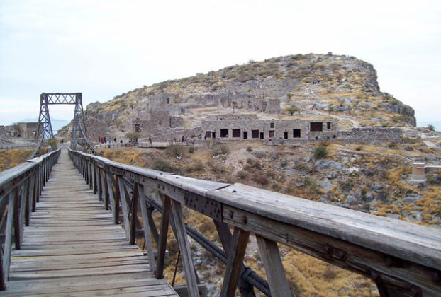 A view of Mexico's Ojuela ghost town from the mine. The narrow suspension bridge, the 'Puente de Ojuela,' is some 900 yards long. © Jeffrey B. Bacon, 2011