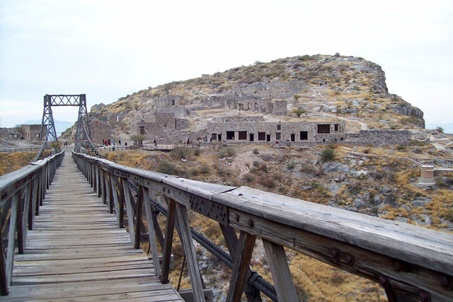 A view of Mexico's Ojuela ghost town from the mine. The narrow suspension bridge, the 'Puente de Ojuela,' is some 900 yards long. © Jeffrey B. Bacon, 2011