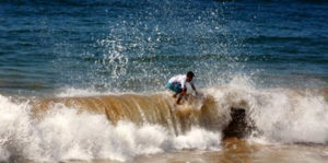 A skimboard rider displays some of the skills as surfers at Melaque on Mexico's Pacific coast. © Gerry Soroka, 2010