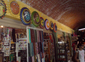 Merchandise spills out from shops to entice shoppers in the artisan's market in Tequisquiapan, Queretaro. © Daniel Wheeler, 2009