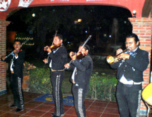 Mariachis are present at almost every special event in Mexico. After the dance band finished playing, they serenaded the Starkman's wedding anniversary party. with Mexican serenata songs. © Alvin Starkman 2008