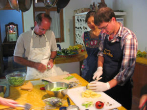 Gloves keep the chiles from burning the cooks' fingers as they prepare authentic Mexican food and salsa. © Alvin Starkman 2008