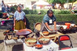 Esther Ramon and her daughter Lupita prepare quesadillas with sunny yellow pumpkin flowers, or squash blossoms.