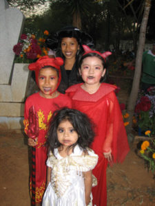 Parents diligently arranged this group of children for photographers. Increasingly, the customs of Hallowe'en are creeping into Day of the Dead festivities in Oaxaca and other parts of Mexico.