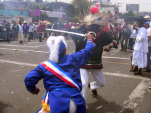 There's a skirmish at every intersection for the annual Cinco de Mayo parade in Mexico City. Costumed residents reenact scenes from the Battle of Puebla, and smoke in the air comes from simulated musket fire. © Donald W. Miles, 2009